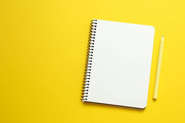 istock Open notebook with pen on color background, top view 2246134831