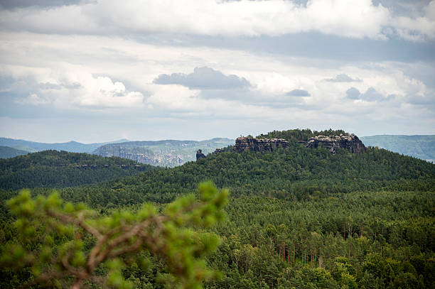 View from the Pfaffenstein and beautiful nature with forests and rock formations in Saxon Switzerland.