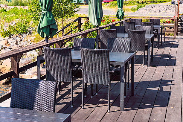 istock Axmar outdoor restaurant deck with empty tables and chairs 2246136127