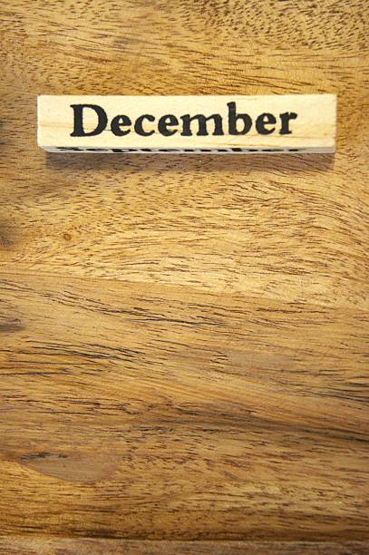 istock December text on wooden cube with wood background, close-up, Copy Space. 2246136272