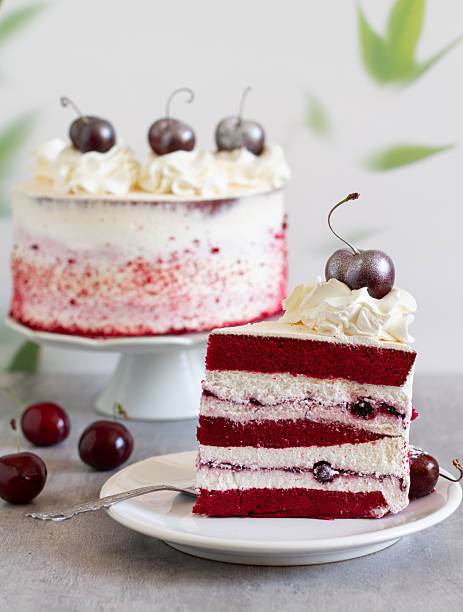 A slice of a red velvet anniversary cake