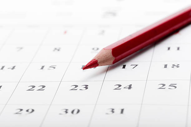 istock Red pencil marking important date on a calendar for planning events and tasks 2246140015