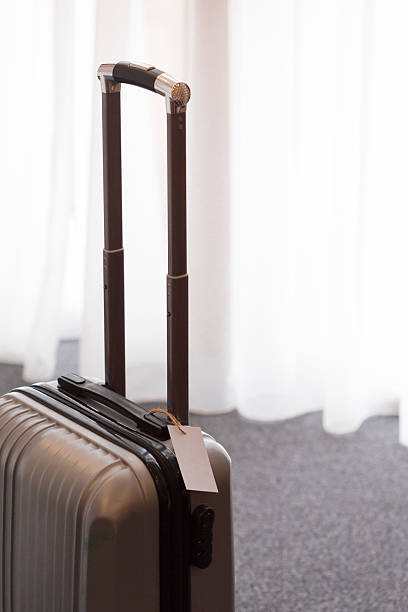 istock Packed luggage ready for the journey near bright window 2246140065