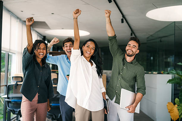 istock Joyful, excited diverse entrepreneurs are celebrating their success and the great work environment 2246141689