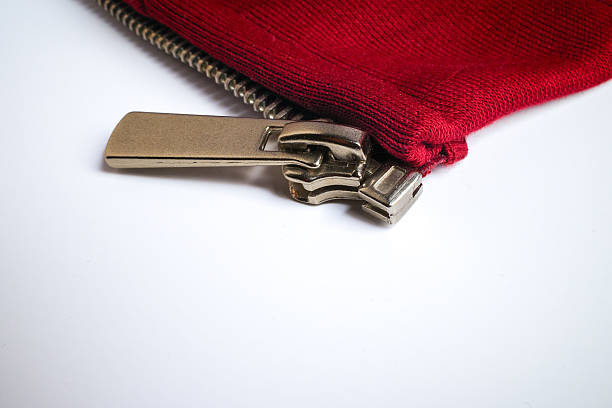 Close-up of a red fabric pouch with a metallic zipper