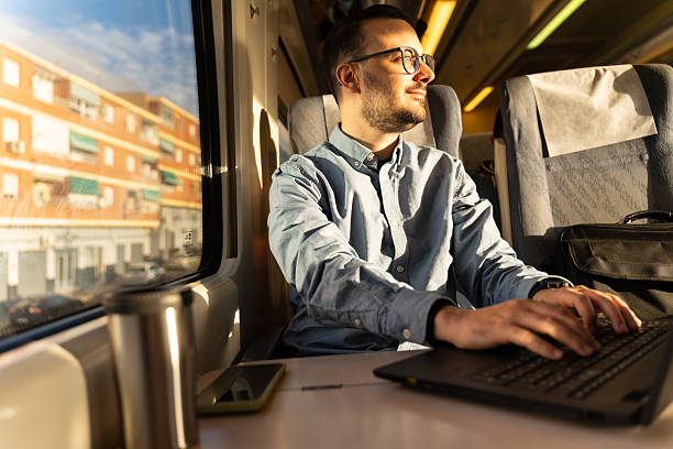 istock Person working on laptop during train journey 2246144664
