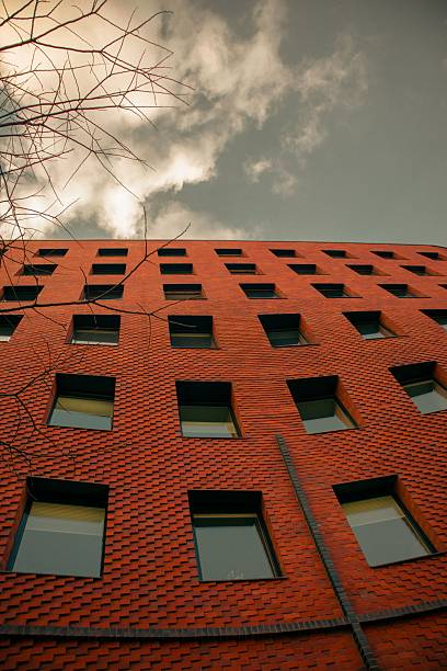 istock Low angle view of a modern red brick building. 2246144813