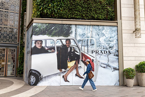 Hong Kong - November 11, 2025 : A pedestrian walks past the Prada store in Tsim Sha Tsui, Kowloon, Hong Kong.