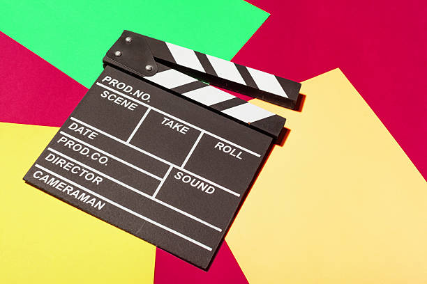 istock Clapperboard on colorful background symbolizes film production and creativity process 2246148679