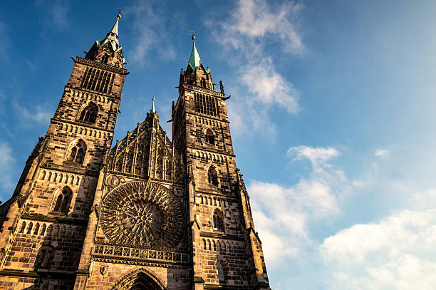 The twin towers and gothic facade of St. Lorenz Church in Nuremberg, Germany.