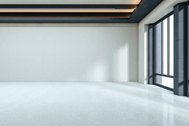 istock Modern empty room interior with large windows, clean white walls and ceiling lights perfect for mockup, branding or poster display concept. 3D Rendering 2246150153