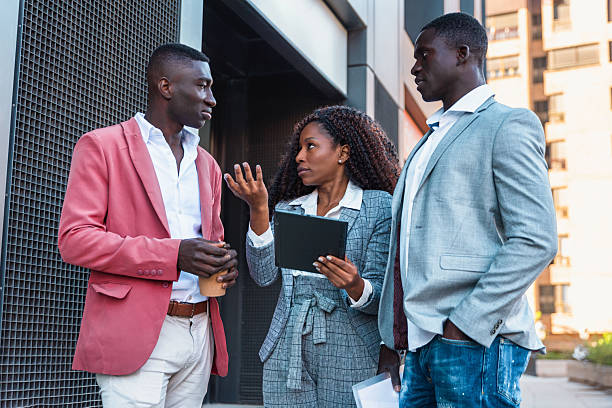 istock Group of multiracial Business people discussing work outdoors using digital tablet 2246150283