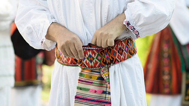 istock Vlach Man Adjusting Traditional Woven Belt on Folk Costume 2246150480