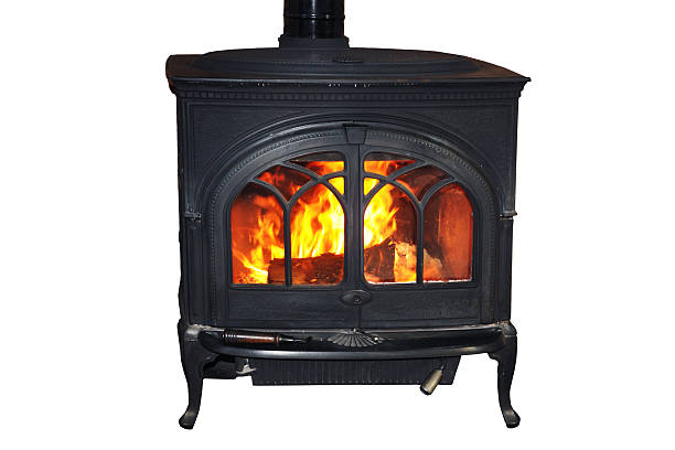 istock Warming fire in a rustic wood burning stove isolated on white background, cut out 2246152384