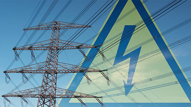 istock Power pole with high-voltage line and electrical symbol in the background 2246152819