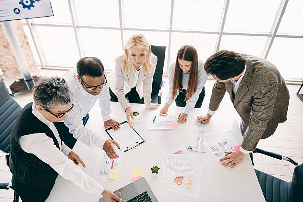 istock Professional team collaborating during a brainstorming session in a modern office workspace 2246153100