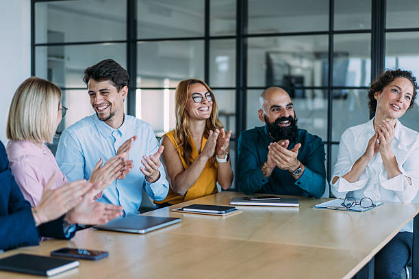 istock Businesspeople applauding during a seminar in conference hall. 2246155524