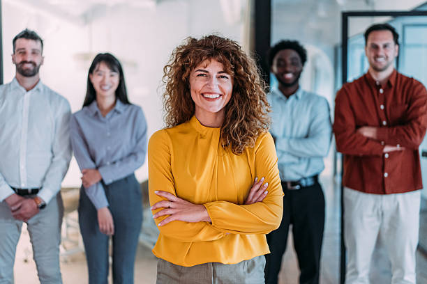 istock Confident businesswoman and her team. 2246155766