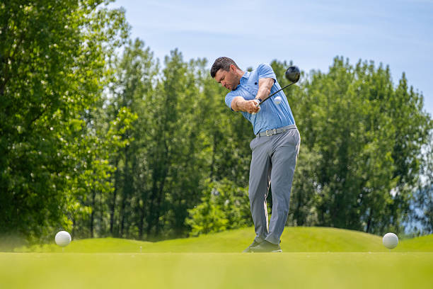 istock Medium Shot Golfer Captured in Motion on Lush Course 2246157619