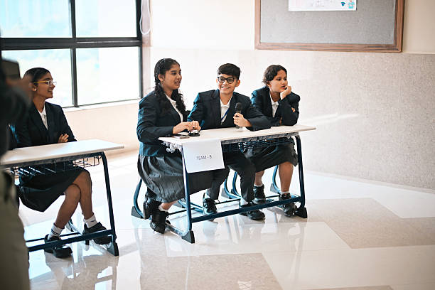 istock Middle School Students Participating in a School Quiz Competition Round 2246157667