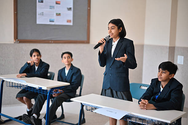 istock School Girl Presents Her Teams' Aurgument During a School Debate Competition 2246157675