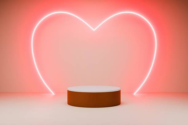 istock A red podium is positioned in front of a glowing neon heart 2246157763