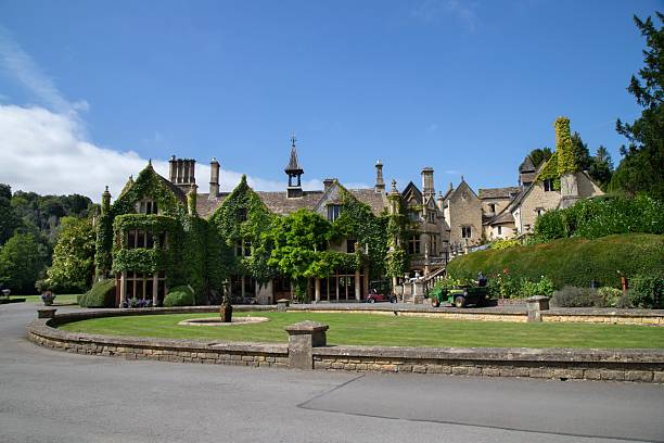 istock Ivy-covered historic manor house with garden 2246159146