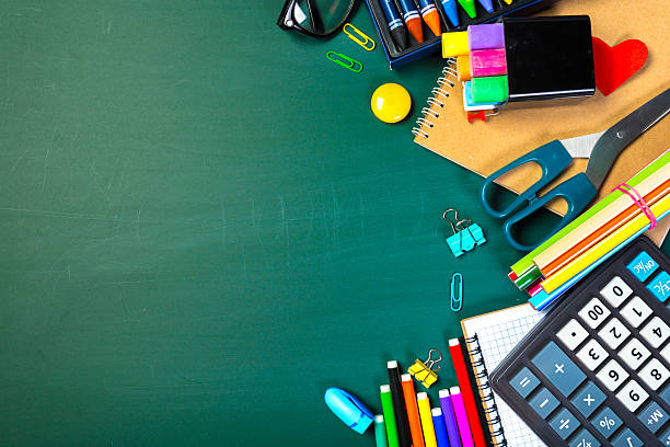 istock Stationery items and office supplies arranged on a green table for creative projects 2246160066