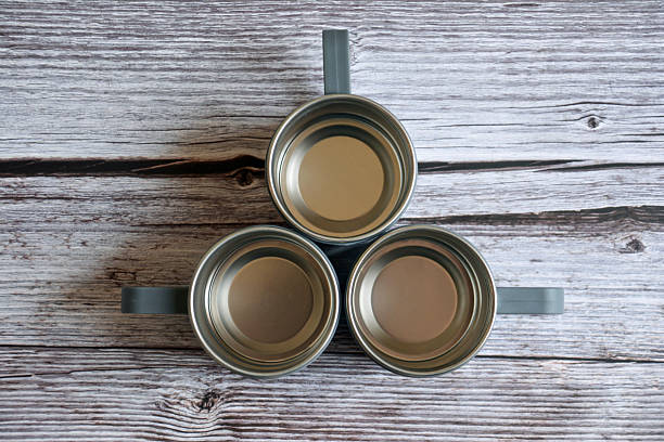 istock Coffee mug on a wooden table. Empty cup on wooden background. Metal cup 2246160182
