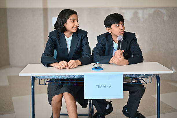 istock Students listening attentively during School Quiz competition Round 2246160349