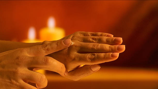 istock Applying Cream to Hands Near Candlelight 2246160635