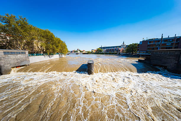 Wroclaw, Poland - September 20 2024: Flood status in Wroclaw, showing emergency preparations, sandbags protecting monuments, and the dramatically high water levels of the Odra River