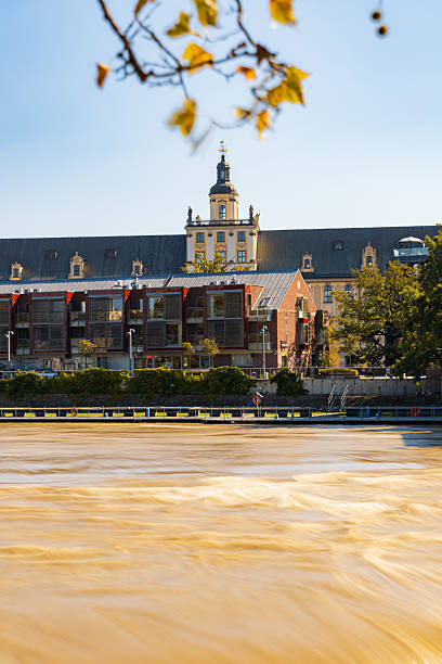 Wroclaw, Poland - September 20 2024: Flood status in Wroclaw, showing emergency preparations, sandbags protecting monuments, and the dramatically high water levels of the Odra River