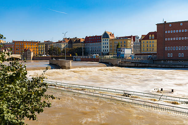 Wroclaw, Poland - September 20 2024: Flood status in Wroclaw, showing emergency preparations, sandbags protecting monuments, and the dramatically high water levels of the Odra River