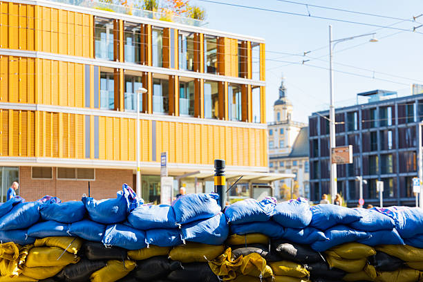 Wroclaw, Poland - September 20 2024: Flood status in Wroclaw, showing emergency preparations, sandbags protecting monuments, and the dramatically high water levels of the Odra River