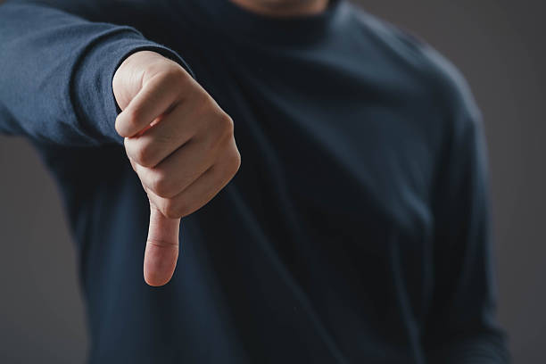 istock A person showing a thumbs-down gesture with hand, symbolizing dislike, disapproval, failure, negative feedback, and rejection concept in communication, business, and social media. 2246166820