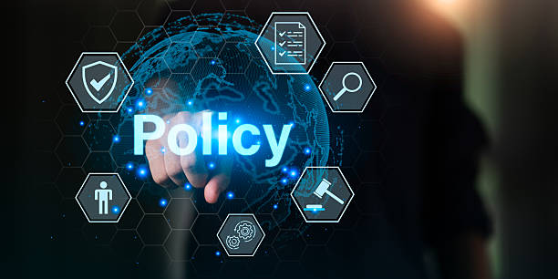 istock A businessman pointing at a digital interface with the word POLICY, representing corporate regulation, business compliance, legal management, and company governance in modern digital administration. 2246166999