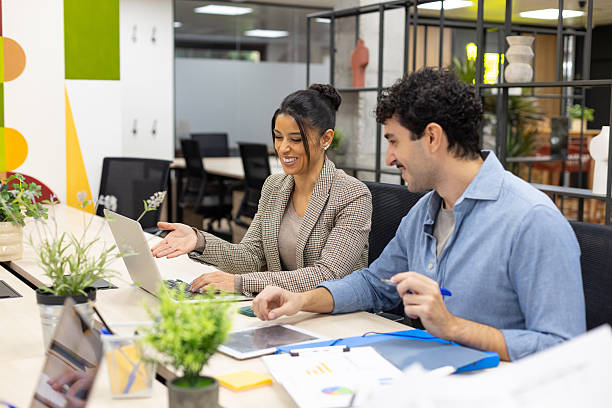istock Business colleagues collaborating on laptop in modern office 2246169533