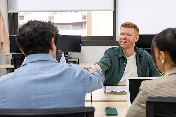 istock Business partners shaking hands in office meeting 2246169539