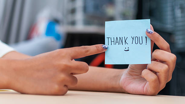 istock Thank you note gesture office space informal environment close-up appreciation concept 2246170748
