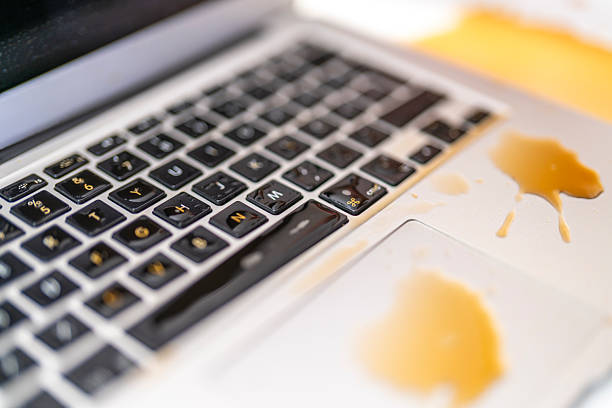 istock Unexpected Liquid Accident Spreading Across Laptop Keyboard in Office Environment 2246172000