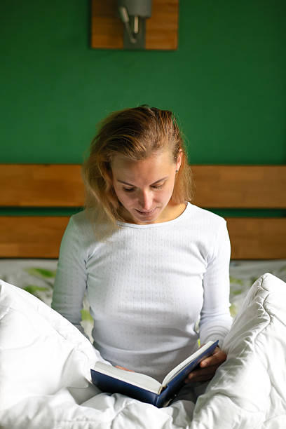 istock Woman in bed on the weekend morning. 2246173300