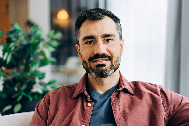 istock Cheerful confident man smiling looking at camera indoors 2246173592