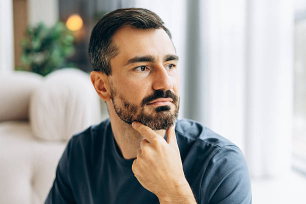 istock Thoughtful man looking away contemplating future decisions 2246174420