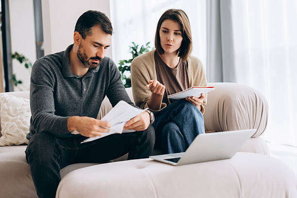istock Couple budgeting home finances planning expenses and future 2246175685