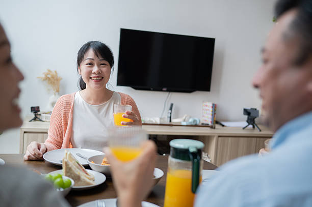 istock Home dinner with sibling gathering happy smiling stock photo 2246182104
