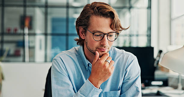 istock Business, man or thinking in office with plan for financial report, problem solving or review. Person, reflection or contemplating in startup with thought for budget, finance management or proposal 2246183558