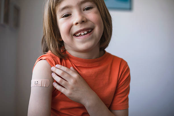 istock Child with adhesive bandage after vaccination 2246185007