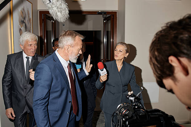 istock Senior Caucasian Man Gesturing While Being Interviewed by Middle Aged Woman 2246185936