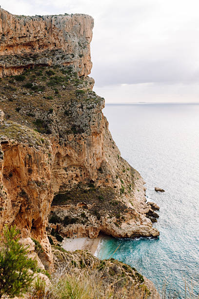 istock Seascape. Rocky cliffs with calm turquoise waters. 2246186908